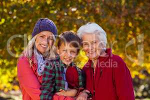 Boy with mother and grandmother at park