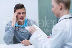 Patient discussing his problem with female patient