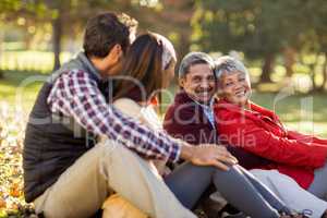 Happy family relaxing at park