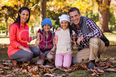 Happy family at park during autumn