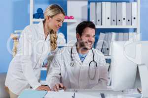 Physiotherapist working on computer