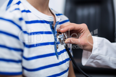 Doctor examining patient with a stethoscope