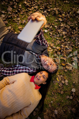 Couple taking selfie at park