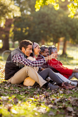 Family sitting at park