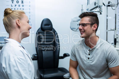 Female optometrist interacting with patient