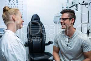 Female optometrist interacting with patient