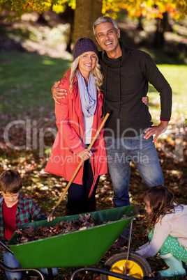 Happy family at park during autumn