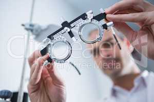Close-up of optometrist holding messbrille