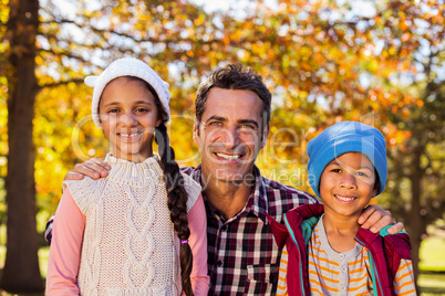 Happy father with son and daughter at park