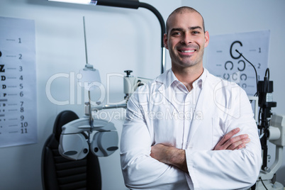 Portrait of male optometrist with arms crossed