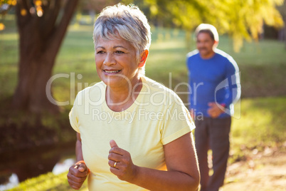 Mature woman running in a park