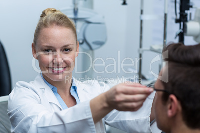 Female optometrist prescribing spectacles to patient