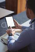 Mature student using digital tablet