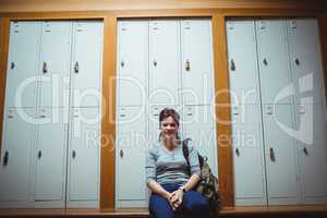 Mature student sitting in the locker room