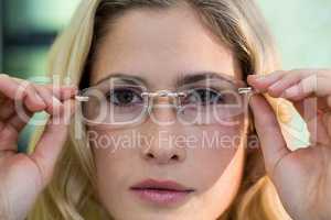 Close-up of female customer trying spectacles