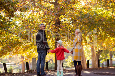 Portrait of family standing by trees