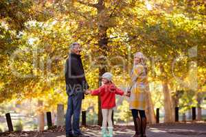 Portrait of family standing by trees
