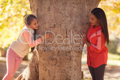 Playful mother with daughter at park