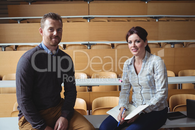 Mature students sitting on desk