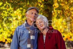 Senior couple with eyes closed at park during autumn
