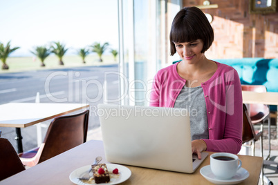 Woman using laptop in the coffee shop