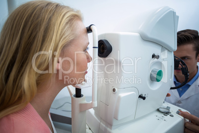 Female patient looking through coreometry