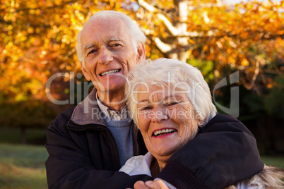 Senior couple embracing at park