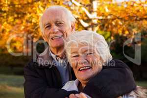 Senior couple embracing at park