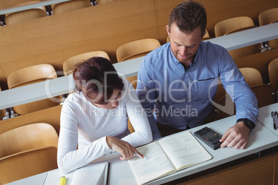 Mature students reading a book