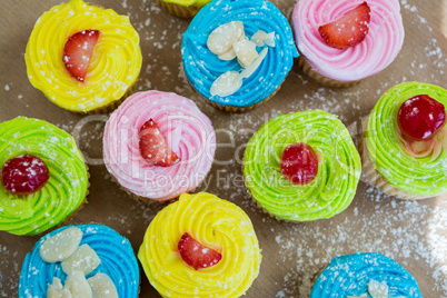 Cupcakes with whipped cream and berries