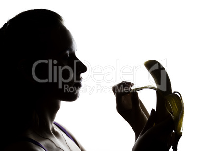 Young amazed woman in lacy lingerie holding a banana, she is going to eat a banana. she sucks a banana