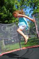 girl jumps on the trampoline
