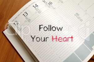 Follow your heart text concept on notebook