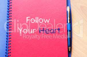 Follow your heart text concept on notebook