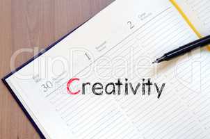 Creativity text concept on notebook