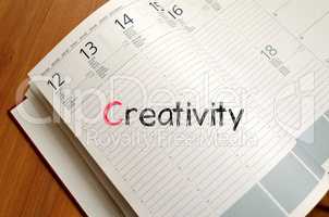 Creativity text concept on notebook