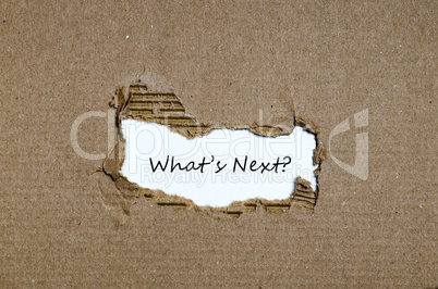 The words what's next appearing behind torn paper