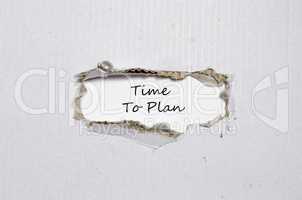 The words time to plan appearing behind torn paper