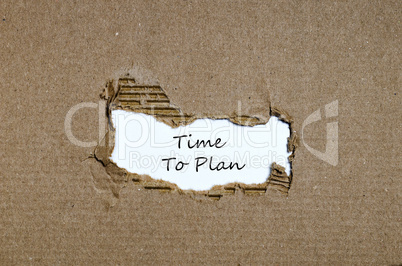 The words time to plan appearing behind torn paper