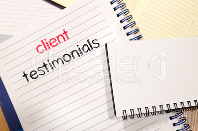 Client testimonials text concept on notebook