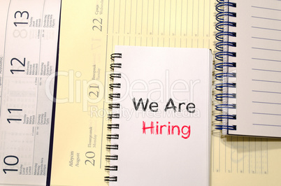 We are hiring text concept on notebook