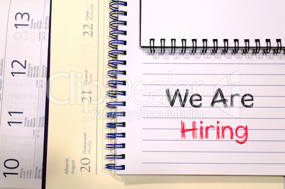 We are hiring text concept on notebook