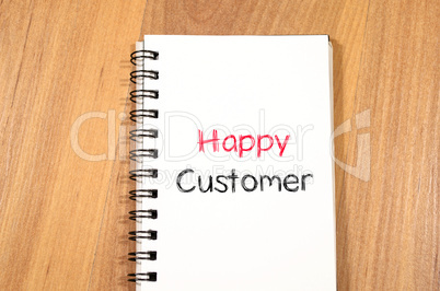Happy customer text concept on notebook
