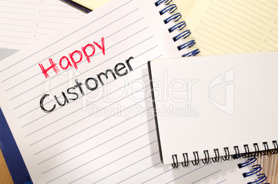 Happy customer text concept on notebook