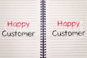 Happy customer text concept on notebook