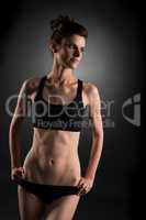 Sport. Photo of pretty woman with trained abs