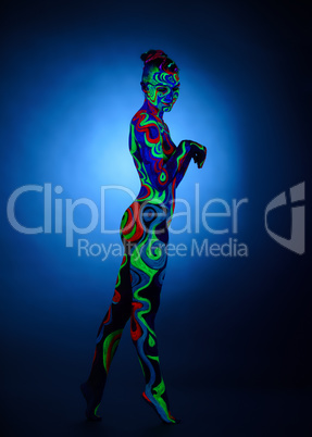 Nude girl posing with glowing patterns on her body