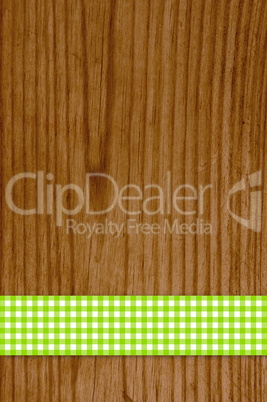 Tischdecke grün weiß auf Holz Hintergrund