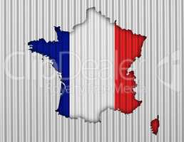 Karte und Fahne von Frankreich auf Wellblech