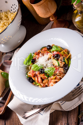 Ribbon Pasta with zucchini and olives in tomato sauce